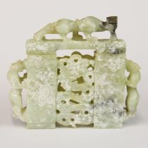 A Chinese carved jade model of a gateway surmounted with dragons, H. 15cm, W. 17cm.