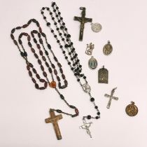 A group of vintage rosaries and other items.