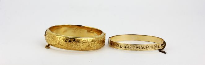 Two 9ct gold and metal core bangles, largest inner dia. 6cm.