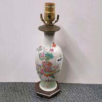 A 19th/early 20th century Chinese hand enamelled porcelain vase mounted as a lamp base, H. 35cm.