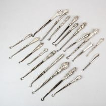 A collection of silver handled Victorian button hooks.