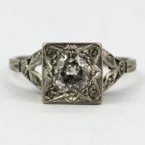 An 18ct gold and platinum ring set with a large old cut diamond, estimated approx. 0.65ct, and