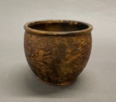 A cold painted and gilt Chinese bowl with relief decoration of dragons and signature to base, Dia.