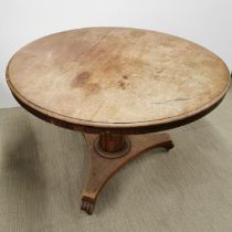 A Regency mahogany veneered pedestal, tilt top dining table, H. 75cm Dia. 120cm.