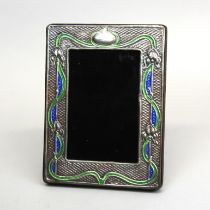 An enamelled Art Nouveau style silver photo frame, stamped sterling. 14.5 x 19 cms.