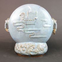 A Chinese 20th cerntury pale blue glazed pottery desk item, H. 33cm, W. 33cm (one handle ring