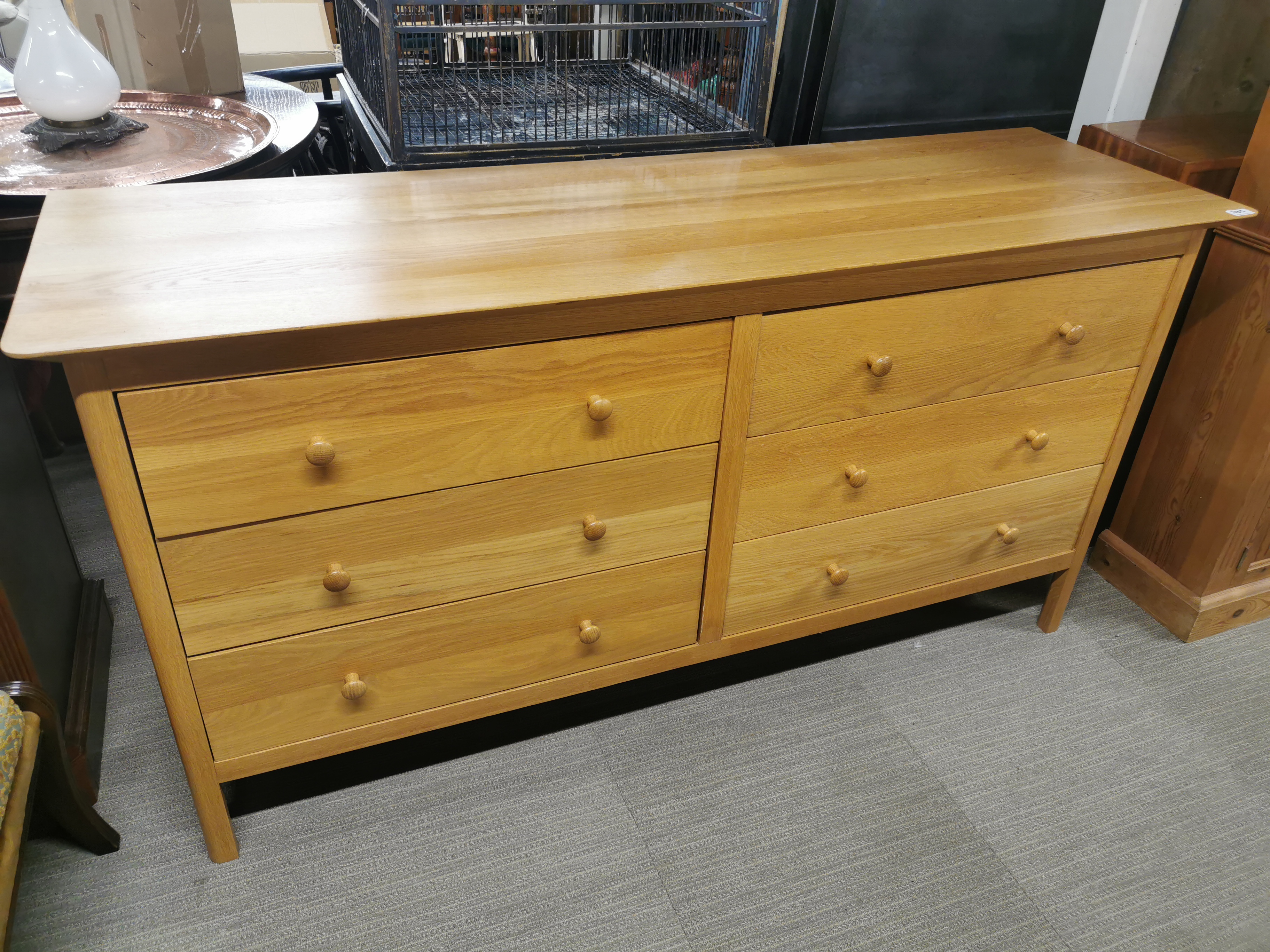 A light oak sideboard/ double chest of drawers with six drawers, 165 x 85 x 52cm.