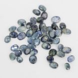 A quantity of unmounted oval cut sapphires, approx. 30ct total.