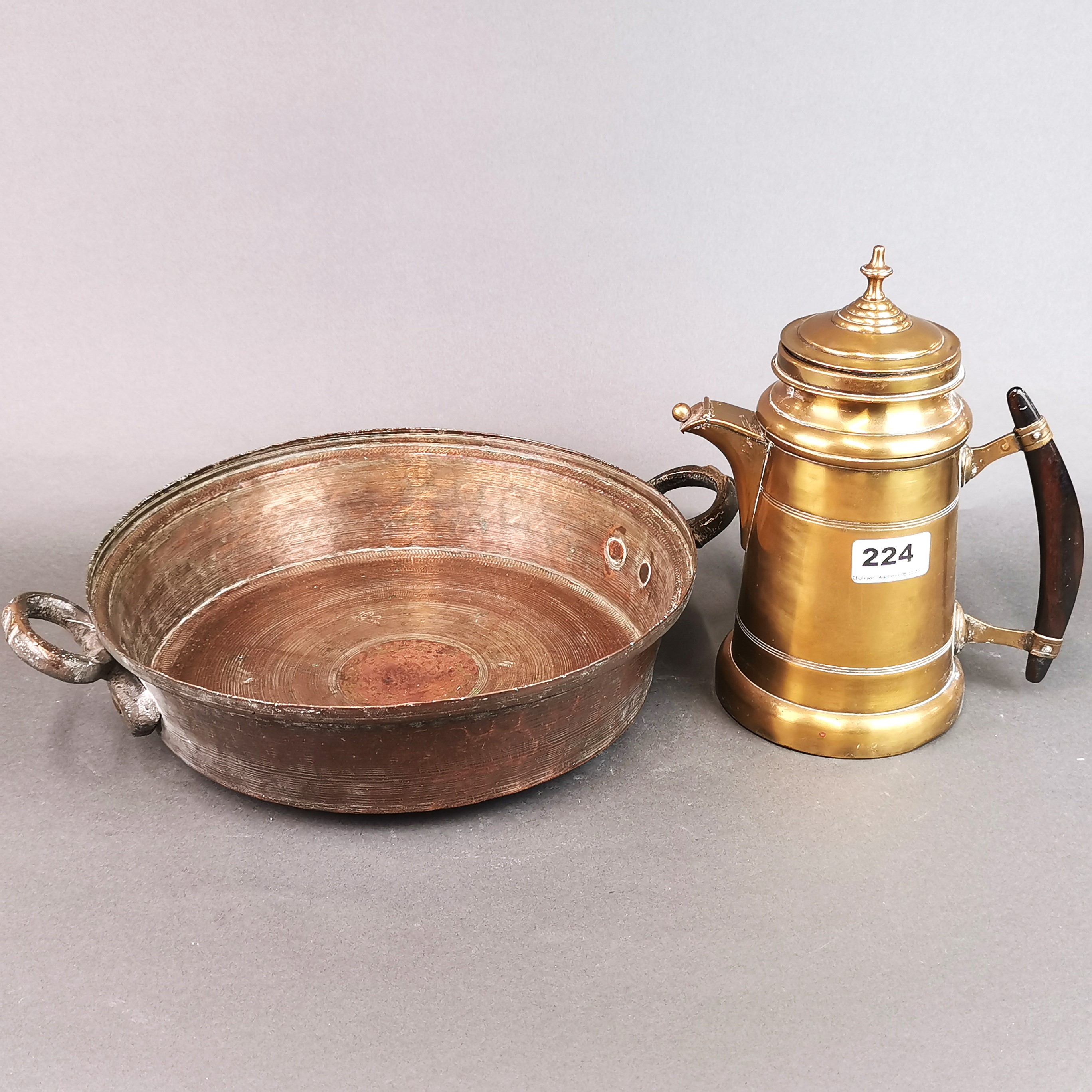 An Eastern hammered copper two handled pan, W. 38cm, together with a 19th century brass jug with