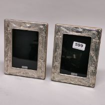 A pair of hallmarked silver Art Nouveau style photo frames, 14 x 18.5cm.