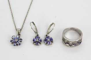 A group of 925 silver and tanzanite jewellery including a pendant and chain with matching drop