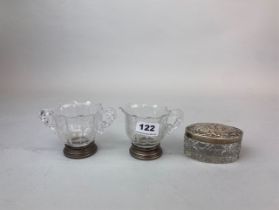An engraved crystal glass jug and bowl with silver feet, stamped sterling together with a hallmarked