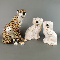 A large ceramic figure of a leopard, H. 34cm, together with a pair of Royal Doulton Staffordshire