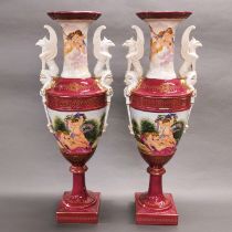 A pair of large porcelain urns, with cherub decoration, H. 63cm.