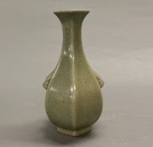 A Chinese celadon crackle glazed hexagonal vase, with moulded dragon head handles, H. 22cm.