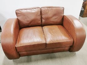 An arch armed leather two seater settee/ sofa, H. 85cm D. 97cm W. 160cm.