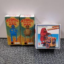 Two boxed tin plate robot toys, box size 14cm. Together with a box tin plate space explorer.