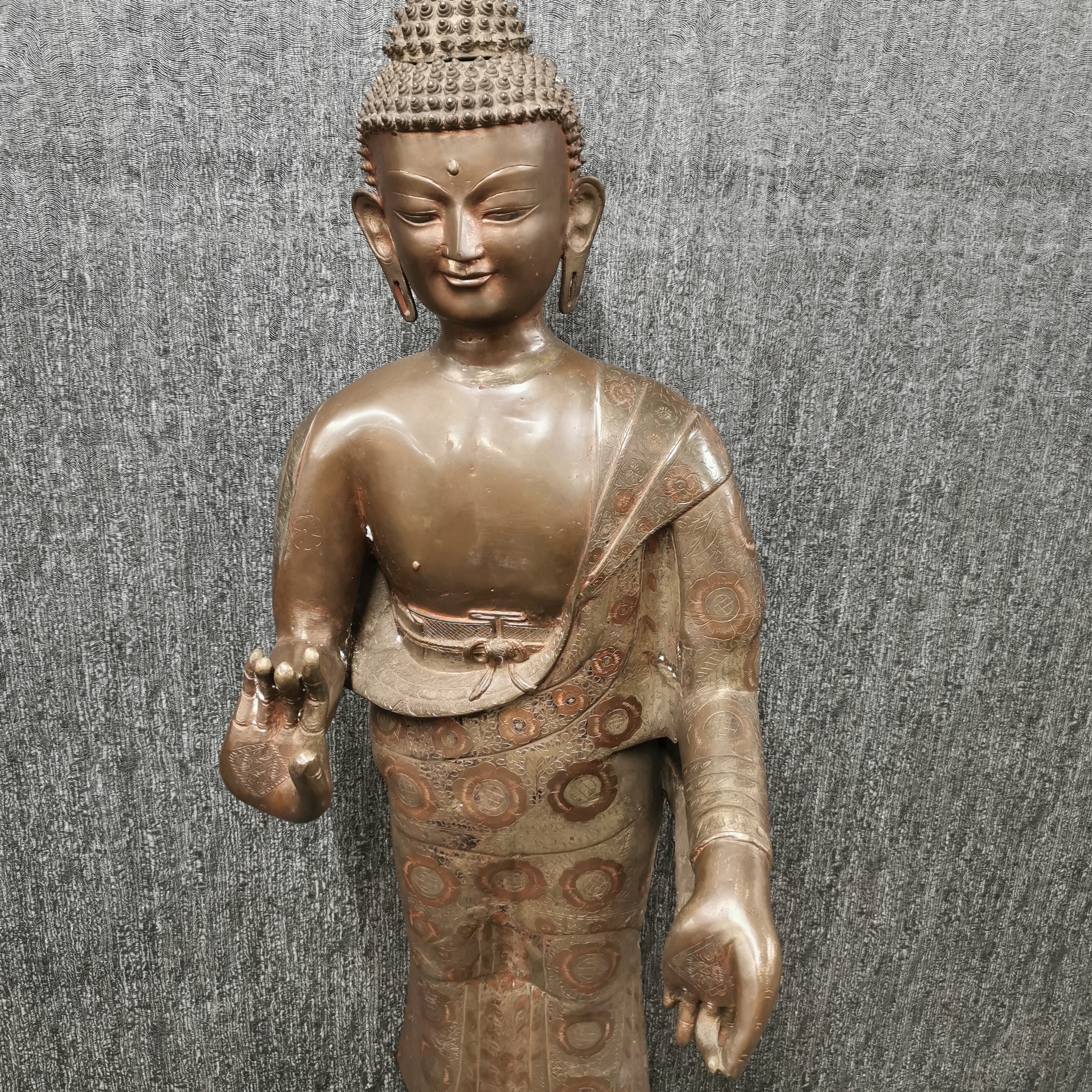 A large bronze standing figure of the Buddha on a lotus base with brass inset decoration, H. 137cm. - Image 2 of 5