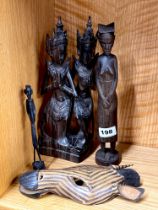 An Indonesian hardwood figure with three further wooden items, tallest 29cm.