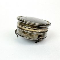 A hallmarked silver and tortoise shell jewellery casket, Dia. 6.5cm. One foot missing.
