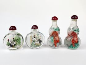A group of four Chinese inside painted snuff bottles, tallest 8cm.