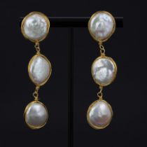 A pair of 18ct yellow gold drop earrings set with large baroque pearls, one pearl L. 1.8cm, drop