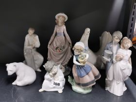 A group of seven Lladro porcelain figures, tallest 26cm.