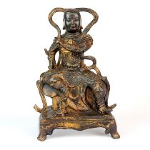 A Sino-Tibetan gilt bronze figure of a guardian deity, H. 25cm.