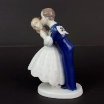 A Royal Copenhagen porcelain figure of two children, H. 18.5cm.