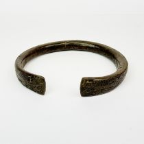 A large bronze slave collar, W. 20cm.