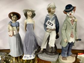 A group of four Lladro porcelain figurines, tallest 23cm.