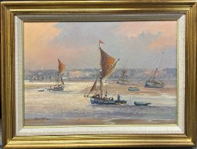 Colin Moore (Scottish b. 1949): A framed oil on canvas of Thames barges with a Kent coast in the