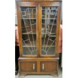 An Art Deco oak and glass display cabinet with two cupboard doors with interesting handles, 170 x 93