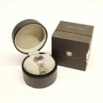 A lady's stainless steel Tag Heuer wristwatch with box and papers.