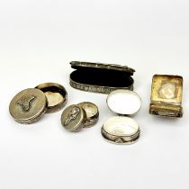 A group of silver and white metal pill boxes, largest 6.5cm.
