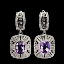 A pair of 925 silver drop earrings set with oval cut amethysts and white stones, L. 3.4cm.