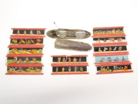 A small group of hand-tinted glass story slides, L. 11cm. Together with a pair of antique