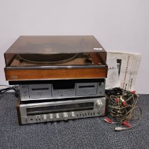 A Goldring record turntable with a Realistic tuner and a tape deck.