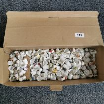 A large quantity of porcelain thimbles.