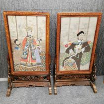 Two antique Chinese hand painted panels of emperor and empress in carved hardwood table screens,