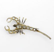 A Victorian silver scorpion shaped brooch set with cabochon moonstones, L. 7cm. Two moonstones