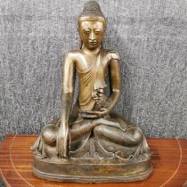 An 18th C. East Asian figure of a seated buddha (probably Annamese), H. 50cm. A/F to rear of the