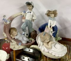 A group of four Lladro porcelain figures of children, tallest 21cm.