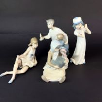 Two Lladro figures, One Nao and one other of children, Tallest 22cm.