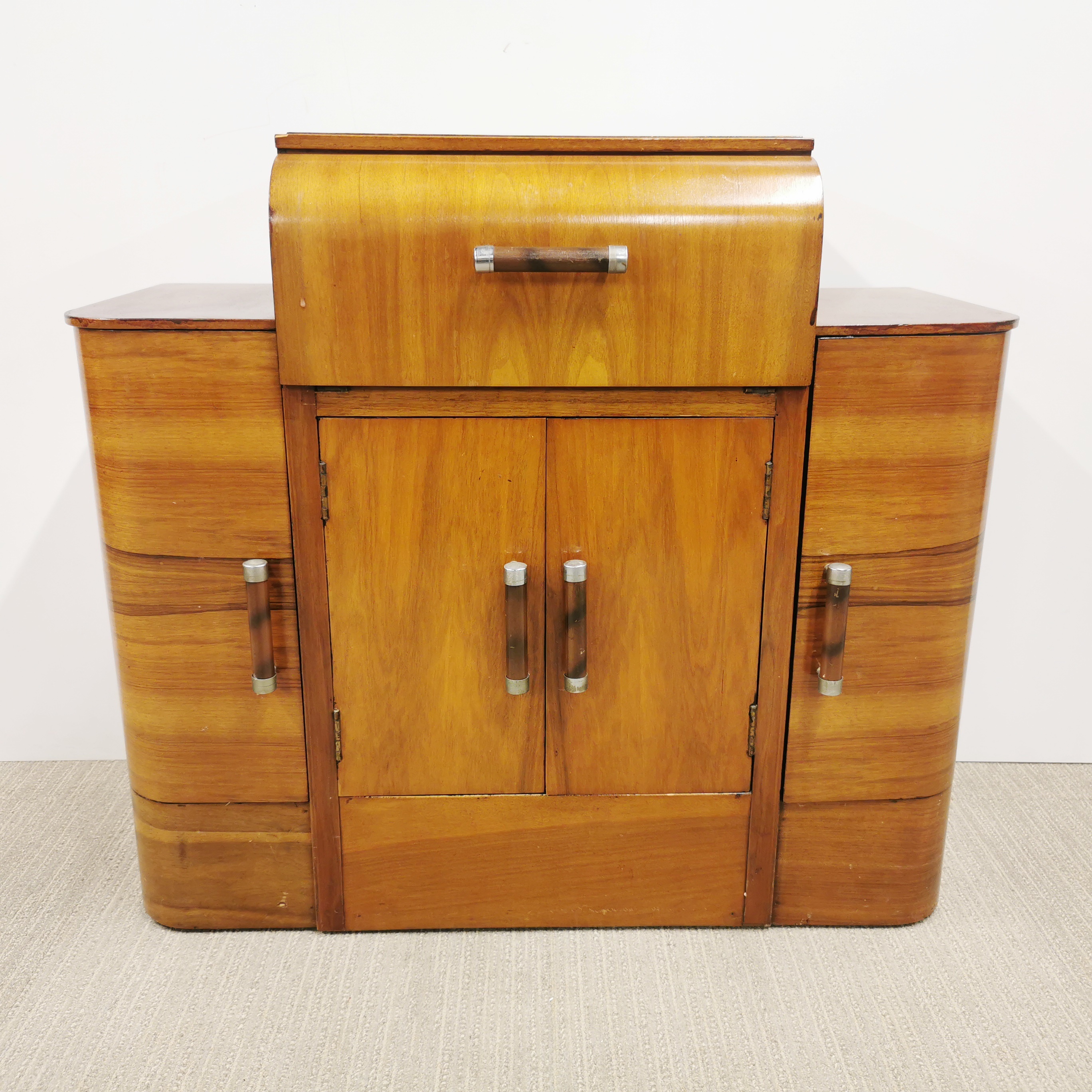 An Art Deco beechwood veneered cabinet with drop down front, 90 x 78 x 38cm. Together with an Art