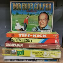A group of boxed vintage board games.