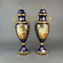 A pair of large mid 20th C. Ormulu mounted porcelain vases and covers, H. 49cm.