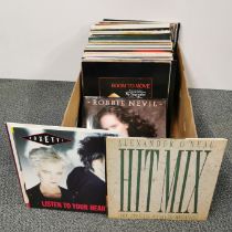 A quantity of pop and rock LP records.