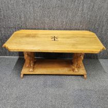 A carved hardwood two tier coffee table with inset palm tree and carved elephant pillars, 94 x 45