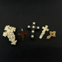 A group of 19th C. carved wood, agate and bone crosses, largest 8.5cm.